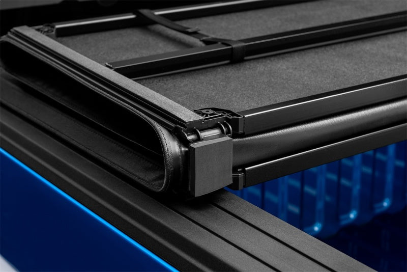 Load image into Gallery viewer, Lund 16-23 Toyota Tacoma (5ft. Bed) Hard Fold Tonneau Cover - Black
