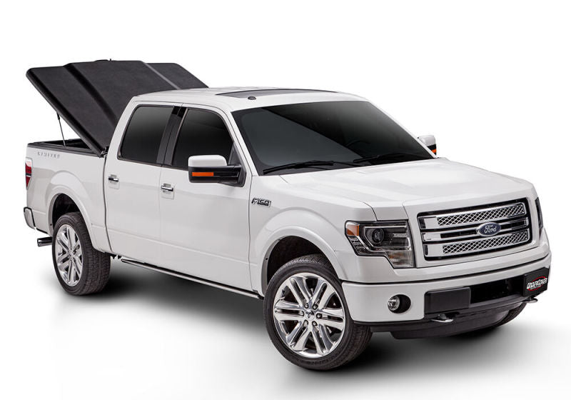 Load image into Gallery viewer, UnderCover 09-14 Ford F-150 6.5ft Elite Bed Cover - Black Textured
