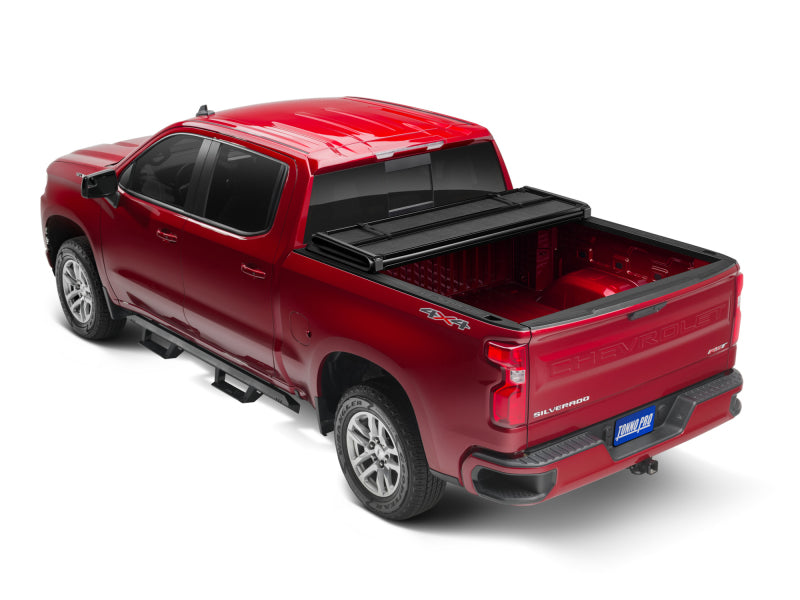 Load image into Gallery viewer, Tonno Pro 04-15 Nissan Titan (Incl. Track Sys Clamp Kit) 5ft. 7in. Bed Hard Fold Tonneau Cover
