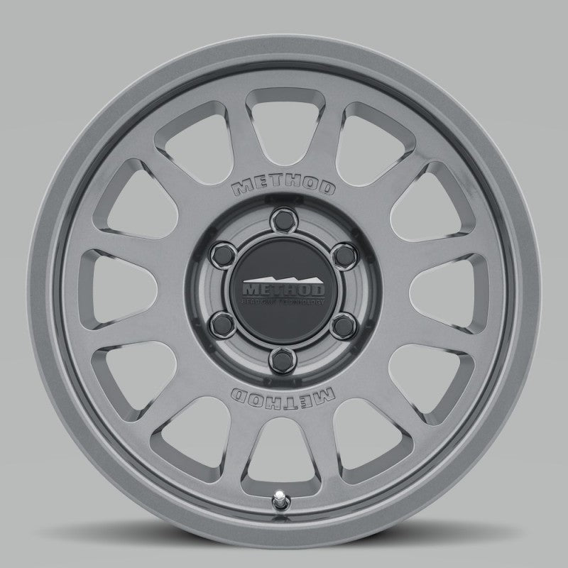 Load image into Gallery viewer, Method MR703 17x7.5 +50mm Offset 6x130 84.1mm CB Gloss Titanium Wheel
