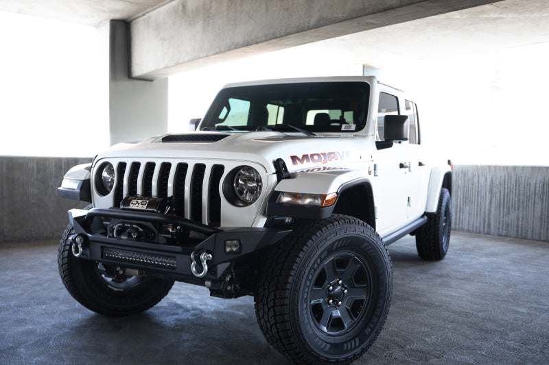 Load image into Gallery viewer, DV8 Offroad 18-23 Jeep Wrangler JL / 20-23 Jeep Gladiator JT FS-7 Mid-Width Winch Front Bumper
