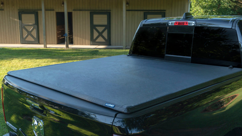 Load image into Gallery viewer, Lund 02-17 Dodge Ram 1500 (5.5ft. Bed) Genesis Tri-Fold Tonneau Cover - Black
