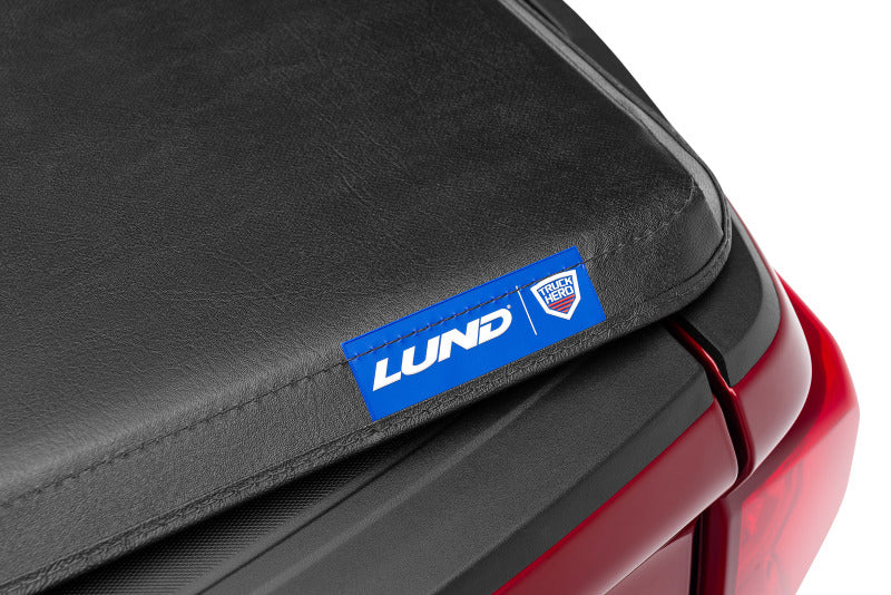 Load image into Gallery viewer, Lund 88-99 Chevy C1500 Fleetside (8ft. Bed) Hard Fold Tonneau Cover - Black
