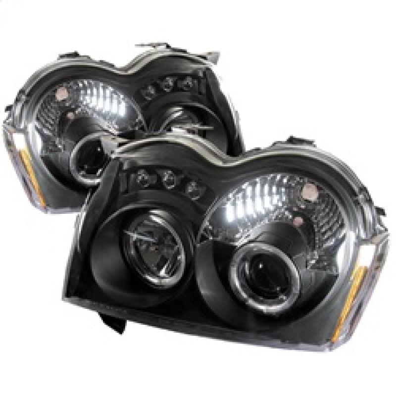Load image into Gallery viewer, Spyder Jeep Grand Cherokee 05-07 Projector Headlights LED Halo LED Blk Low 9006 PRO-YD-JGC05-HL-BK
