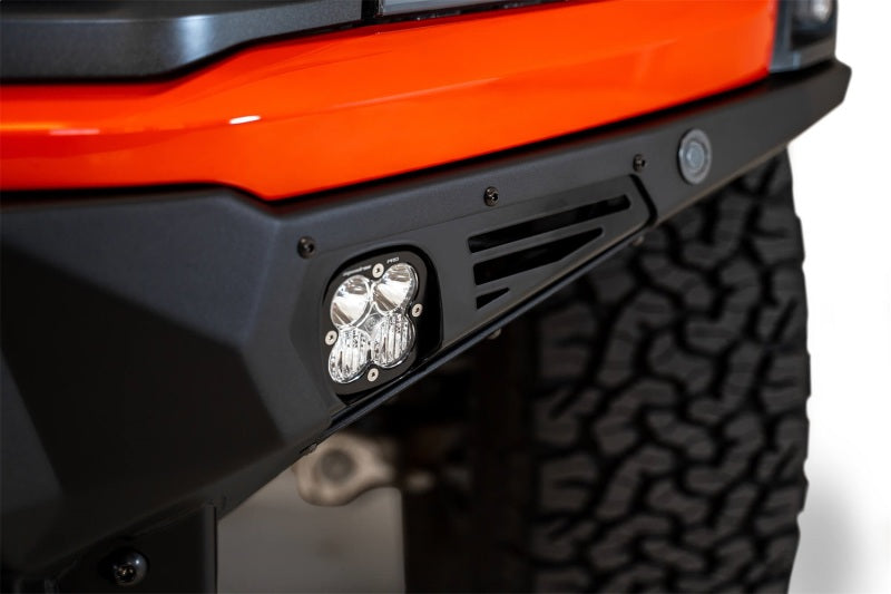 Load image into Gallery viewer, Addictive Desert Designs 2021+ Ford Raptor Bomber Front Bumper w/ 3 Baja Designs LP6 Light Mounts
