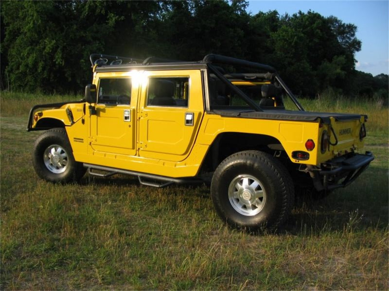 Load image into Gallery viewer, N-Fab Nerf Step 00-06 Hummer H1 SUV 4 Door - Gloss Black - W2W - 3in
