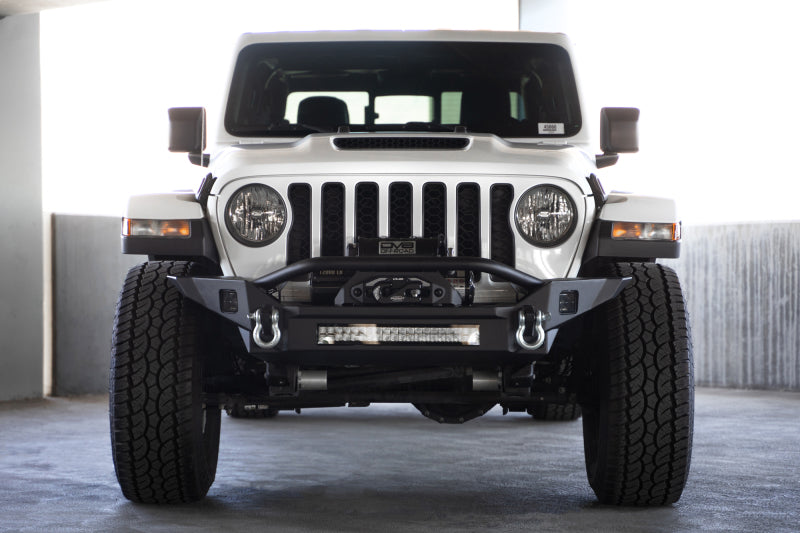 Load image into Gallery viewer, DV8 Offroad 18-23 Jeep Wrangler JL / 20-23 Jeep Gladiator JT FS-7 Mid-Width Winch Front Bumper
