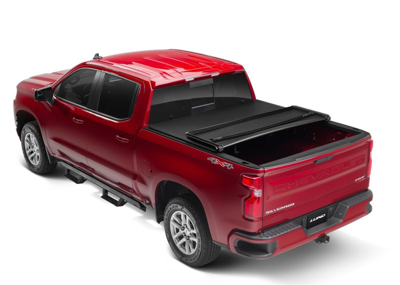 Load image into Gallery viewer, Lund 07-13 Chevy Silverado 1500 (5.5ft. Bed) Genesis Tri-Fold Tonneau Cover - Black
