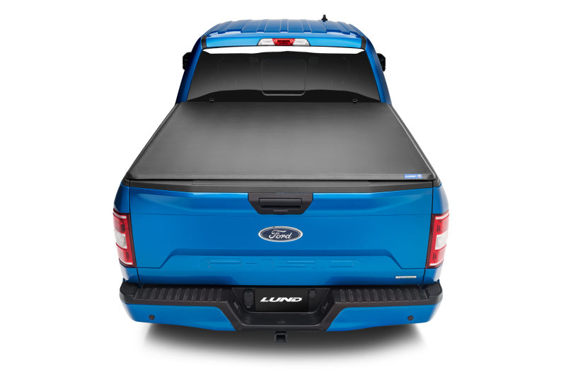 Load image into Gallery viewer, Lund 15-18 Ford F-150 Styleside (5.5ft. Bed) Hard Fold Tonneau Cover - Black

