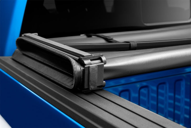 Load image into Gallery viewer, Lund 15-18 Ford F-150 (5.5ft. Bed) Genesis Tri-Fold Tonneau Cover - Black
