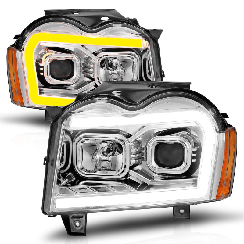 Load image into Gallery viewer, ANZO 05-07 Jeep Grand Cherokee Projector Headlights - w/ Light Bar Switchback Chrome Housing
