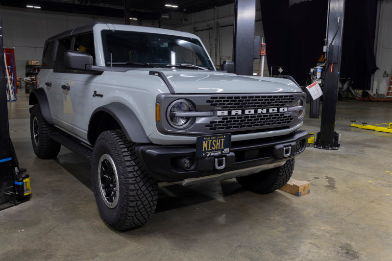 Load image into Gallery viewer, Mishimoto 2022+ Ford Bronco Capable Bumper License Plate Relocation
