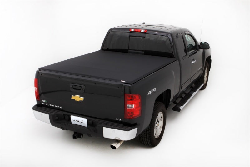 Load image into Gallery viewer, Lund 07-13 Chevy Silverado 1500 (6.5ft. Bed) Genesis Elite Tri-Fold Tonneau Cover - Black
