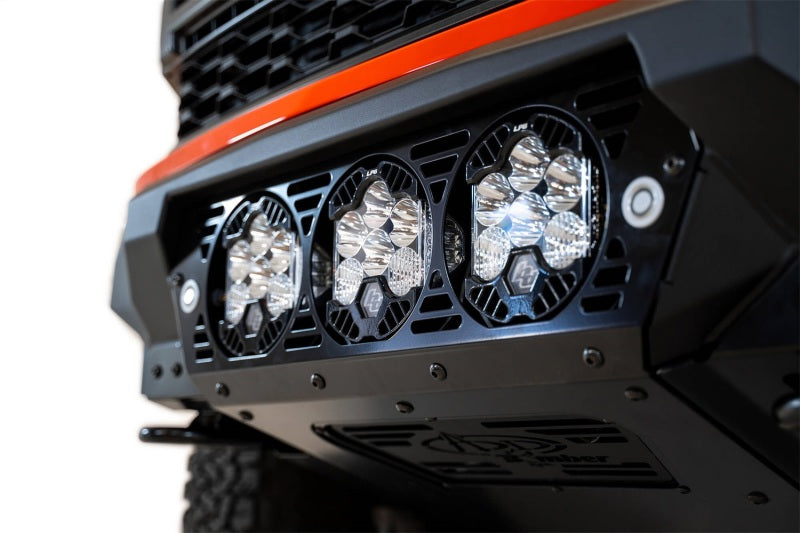 Load image into Gallery viewer, Addictive Desert Designs 2021+ Ford Raptor Bomber Front Bumper w/ 3 Baja Designs LP6 Light Mounts
