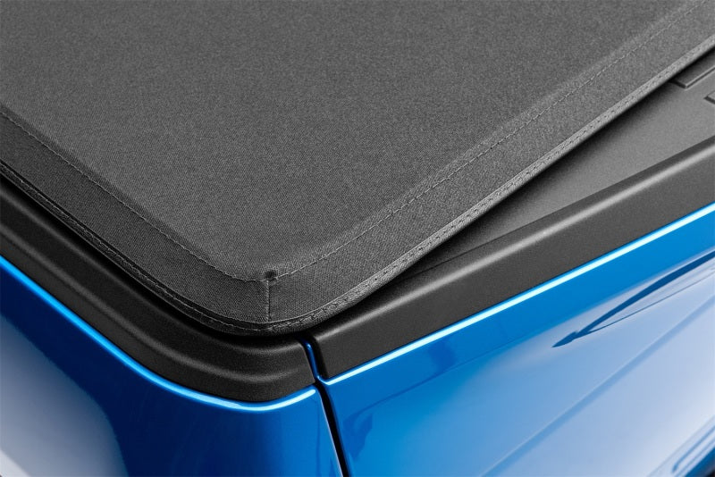 Load image into Gallery viewer, Lund 14-17 Chevy Silverado 1500 (6.5ft. Bed) Genesis Elite Tri-Fold Tonneau Cover - Black
