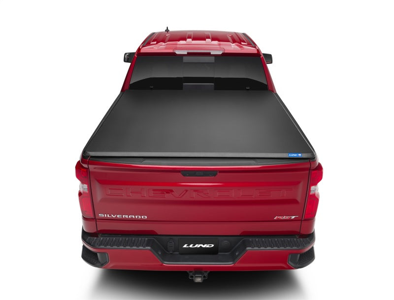 Load image into Gallery viewer, Lund 07-13 Chevy Silverado 1500 (5.5ft. Bed) Genesis Tri-Fold Tonneau Cover - Black
