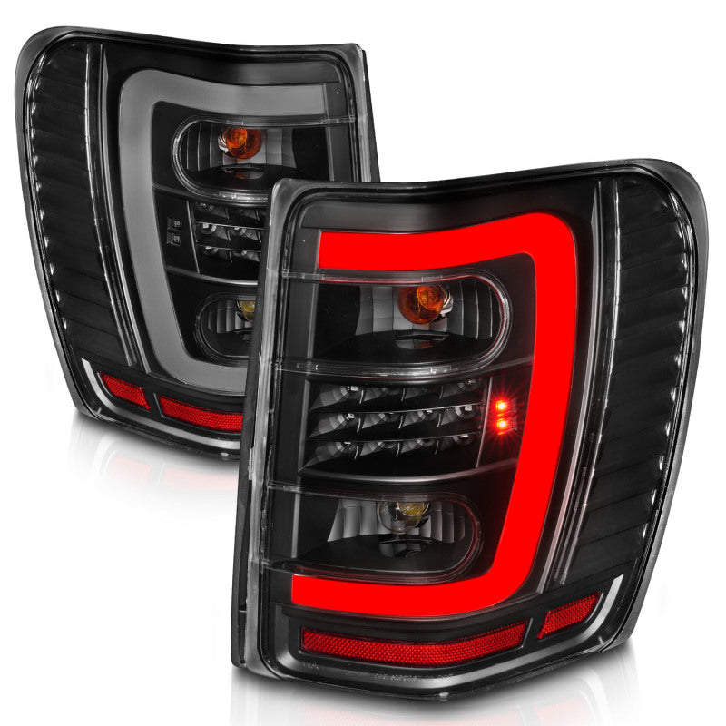 Load image into Gallery viewer, ANZO 1999-2004 Jeep Grand Cherokee LED Tail Lights w/ Light Bar Black Housing Clear Lens
