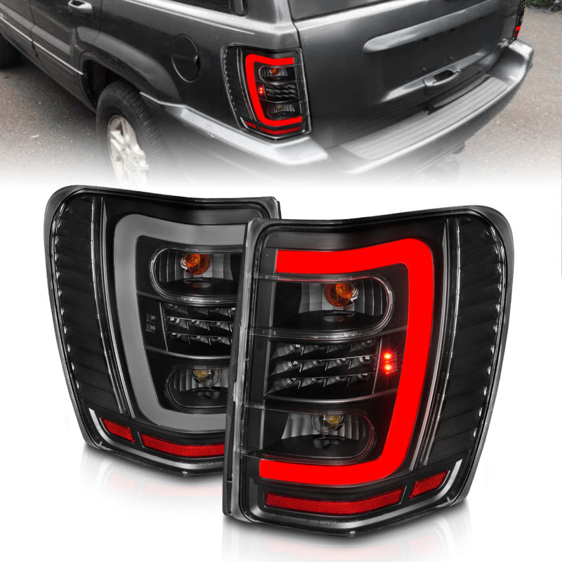 Load image into Gallery viewer, ANZO 1999-2004 Jeep Grand Cherokee LED Tail Lights w/ Light Bar Black Housing Clear Lens
