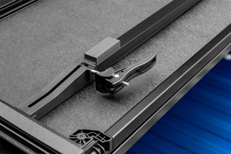 Load image into Gallery viewer, Lund 15-17 Chevy Colorado Fleetside (5ft. Bed) Hard Fold Tonneau Cover - Black
