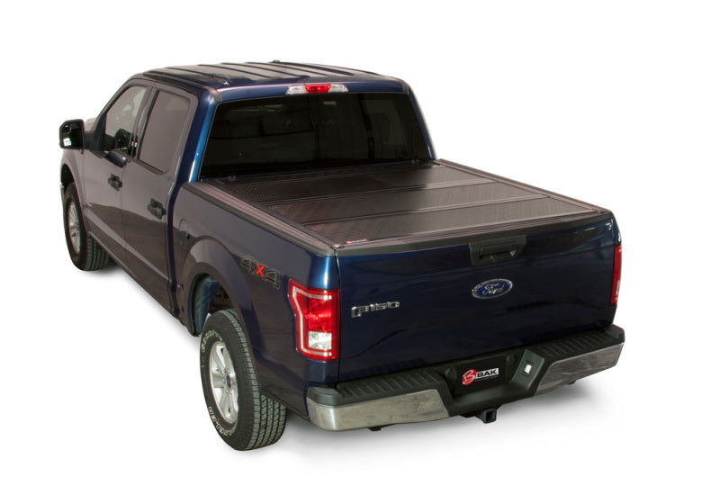Load image into Gallery viewer, BAK 08-16 Ford Super Duty 6ft 9in Bed BAKFlip FiberMax
