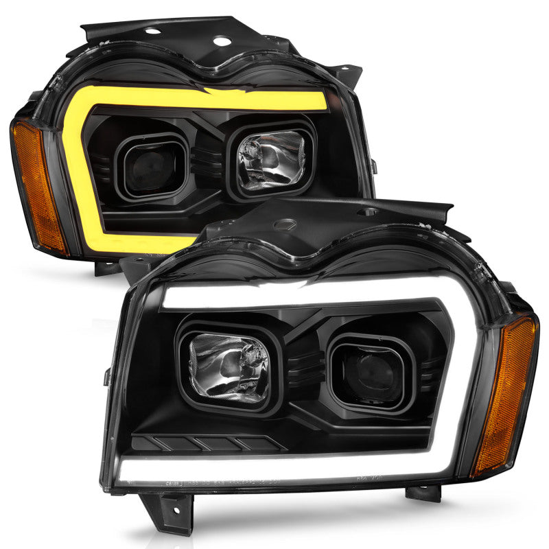 Load image into Gallery viewer, ANZO 2005-2007 Jeep Grand Cherokee Projector Headlights w/ Light Bar Switchback Black Housing
