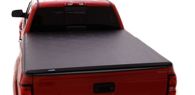 Load image into Gallery viewer, Lund 07-13 Toyota Tundra Fleetside (8ft. Bed) Hard Fold Tonneau Cover - Black
