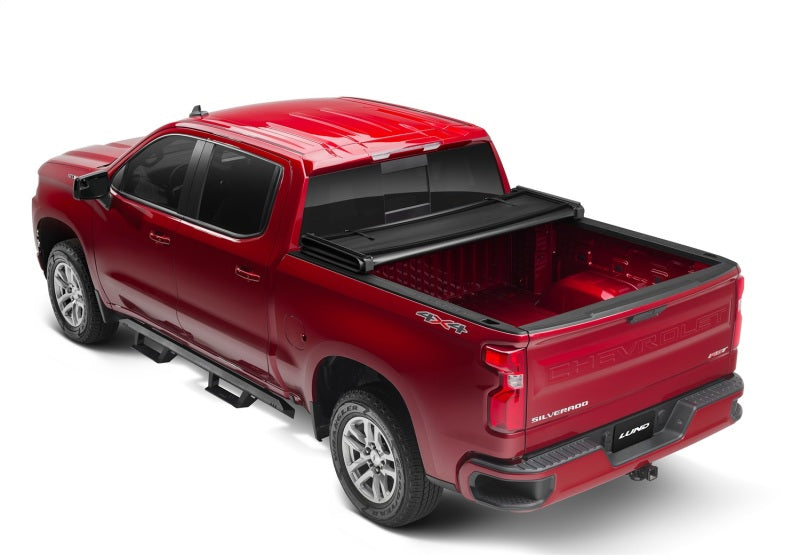 Load image into Gallery viewer, Lund 07-13 Chevy Silverado 1500 (5.5ft. Bed) Genesis Tri-Fold Tonneau Cover - Black
