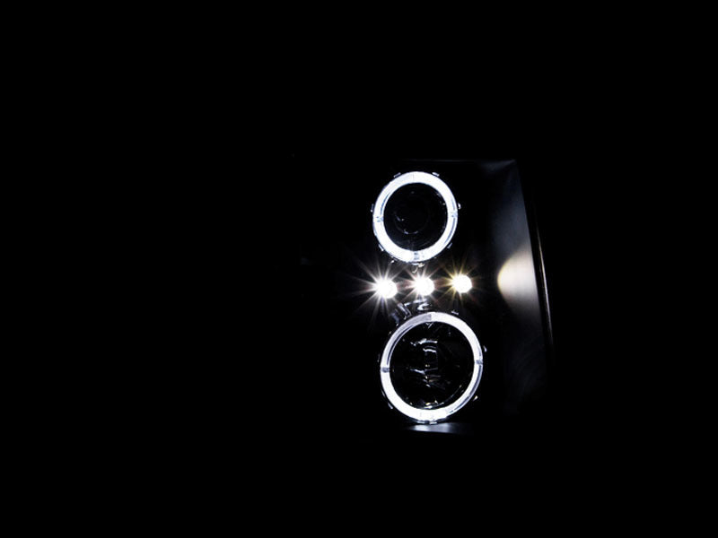 Load image into Gallery viewer, ANZO 2007-2013 Chevrolet Silverado 1500 Projector Headlights w/ Halo Black
