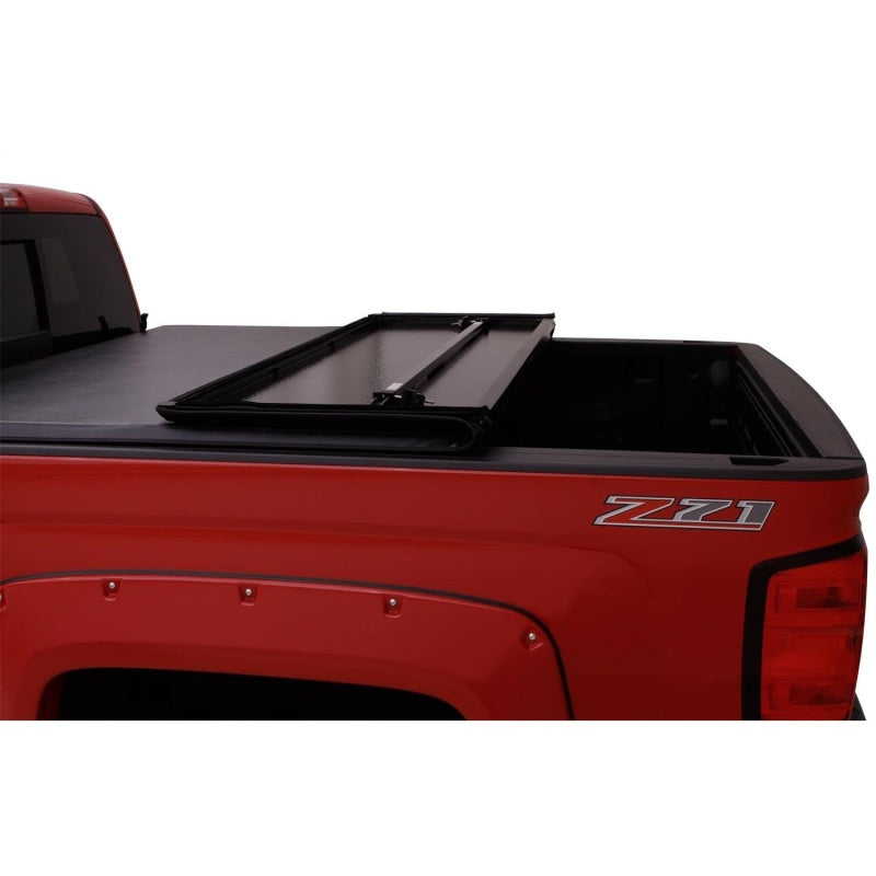 Load image into Gallery viewer, Lund 16-23 Toyota Tacoma (5ft. Bed) Hard Fold Tonneau Cover - Black
