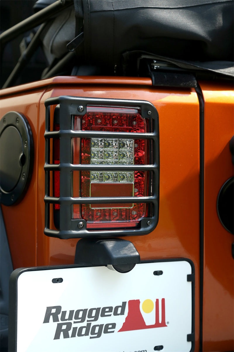 Load image into Gallery viewer, Rugged Ridge 07-18 Jeep Wrangler Textured Black Tail Light Euro Guards
