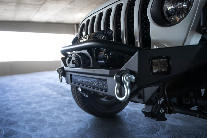 Load image into Gallery viewer, DV8 Offroad 18-23 Jeep Wrangler JL / 20-23 Jeep Gladiator JT FS-7 Mid-Width Winch Front Bumper
