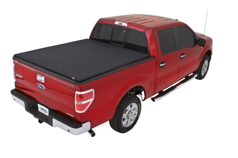 Load image into Gallery viewer, Lund 04-14 Ford F-150 (6.5ft. Bed) Genesis Elite Tri-Fold Tonneau Cover - Black
